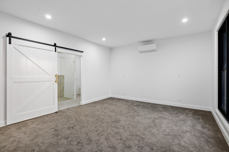 Bedroom with sliding barn door