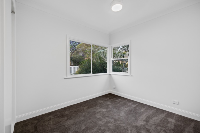 Bedroom with corner windows