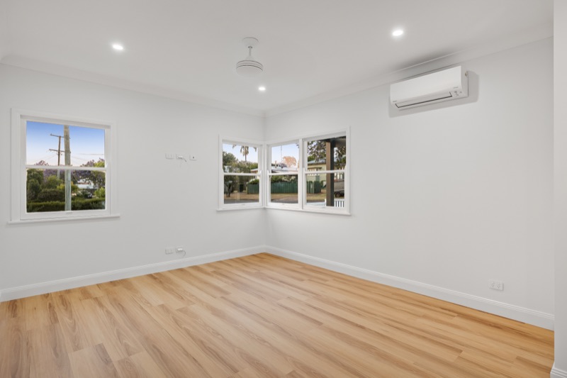 Bedroom with timber floor and corner windows