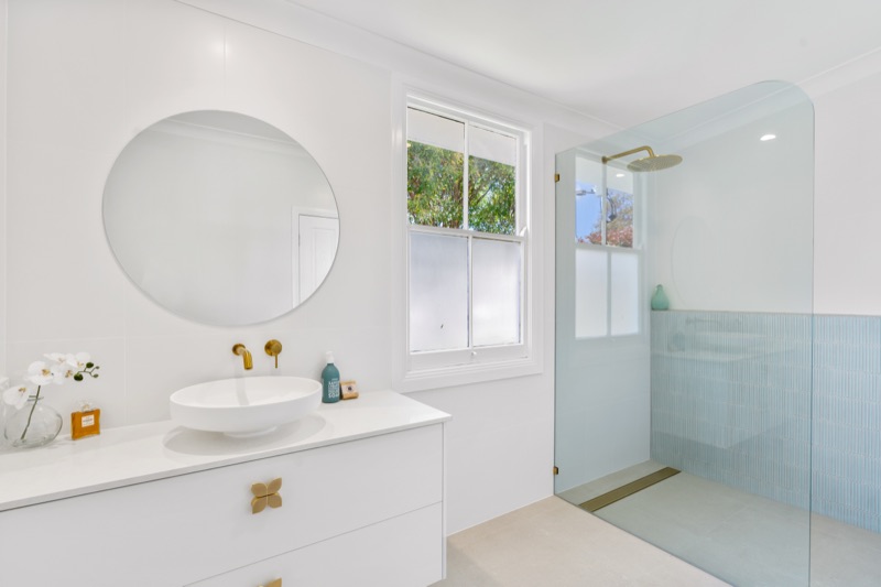 Bathroom vanity with round mirror