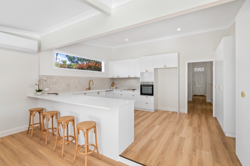 Kitchen with stone benchtops and timber floors